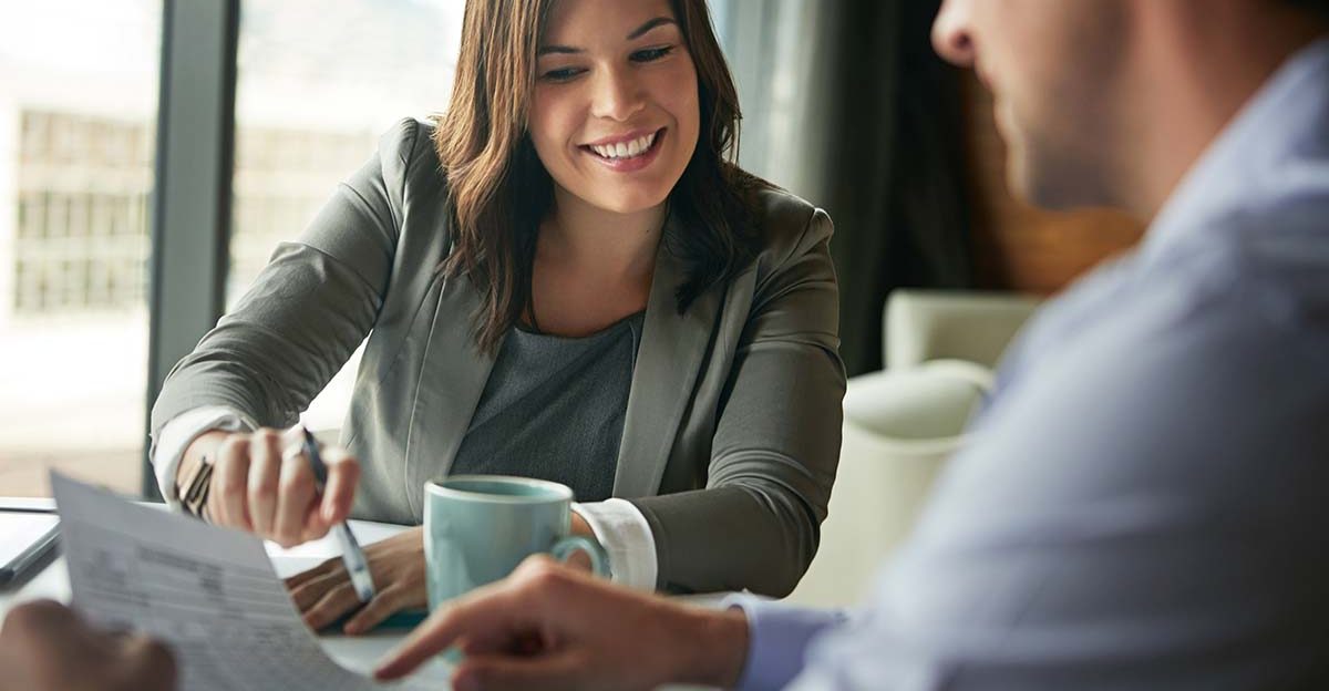 Professional meeting to evaluate company performance through EBITDA metrics.